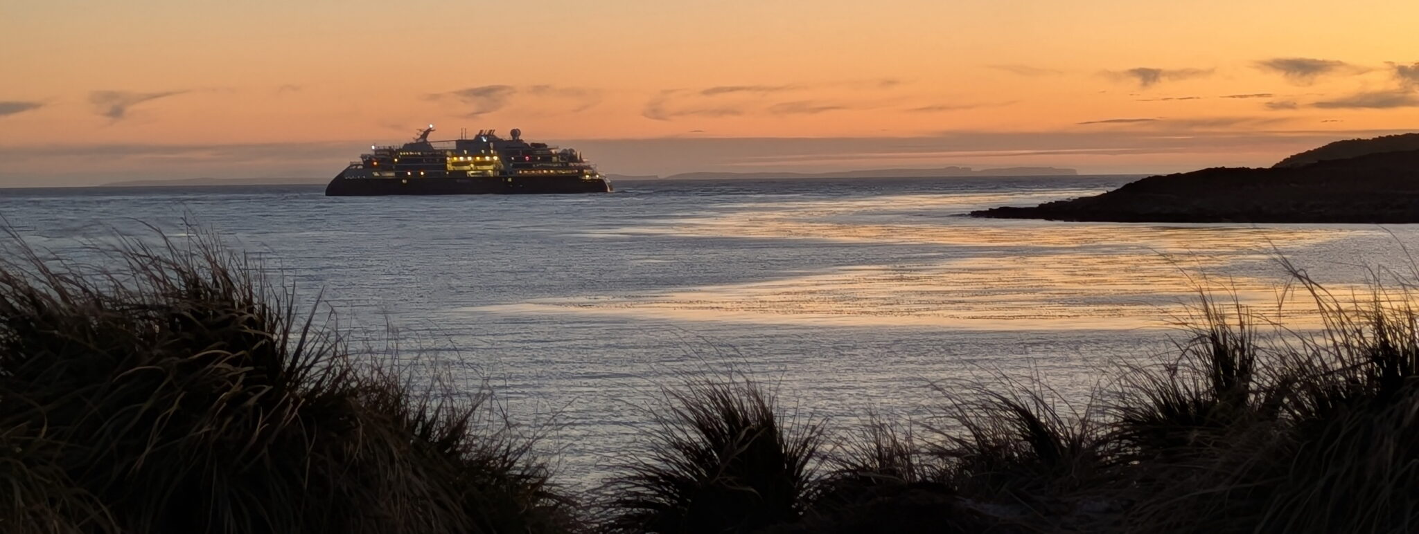 The National Geographic Resolution sails away from Bense Island after dropping off the SAFER team.